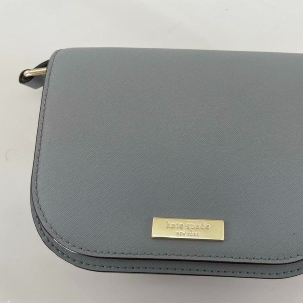 Kate Spade Cross body small bag - strap is matching color to the bag